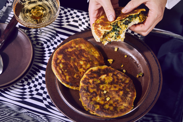 Filled flatbreads with kale and potato masala.