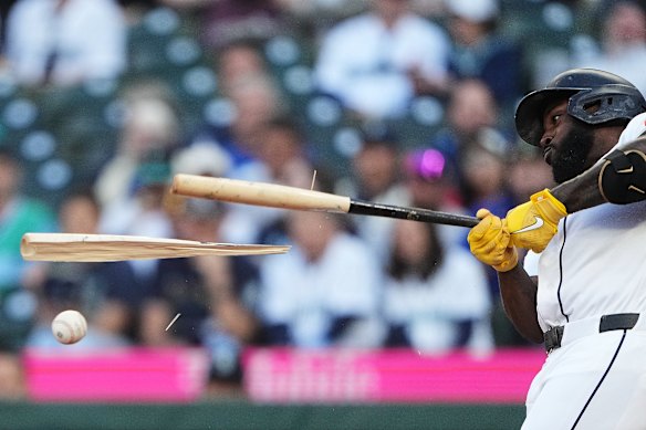 Seattle Mariners’ Randy Arozarena breaks his bat as he hits into a force out of Josh Naylor at second base during the second inning of a baseball game against the Atlanta Braves in Seattle.