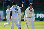 South Africa’s Kagiso Rabada, centre, celebrates the wicket of Australia’s Nic Maddinson, right, on day four.