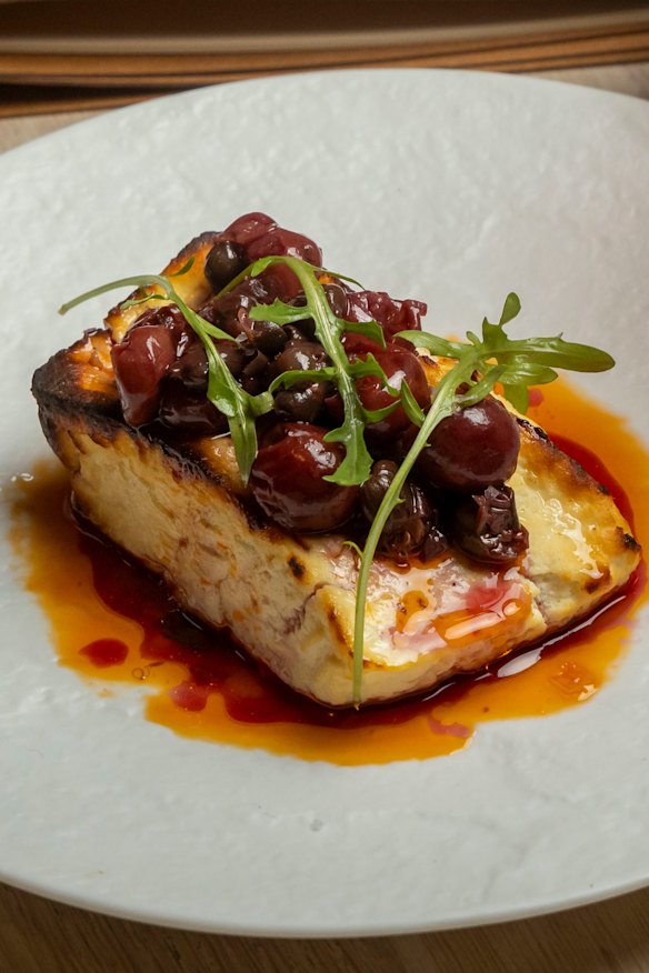 Baked cheese with sour cherry and caper relish.