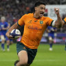 Australia’s Lalakai Foketi celebrates as he scores the opening try during the Autumn Nations Cup rugby union international match between France and Australia at the Stade de France, in Saint-Denis, near Paris, Saturday, Nov. 5, 2022. (AP Photo/Thibault Camus)