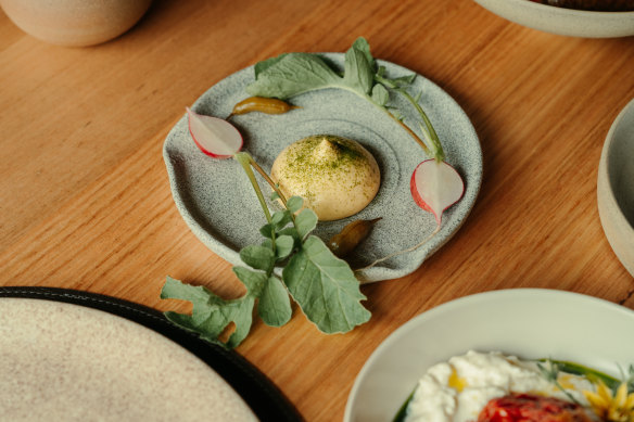 Meals kick off with snacks such as baby radish with sabayon and lovage.