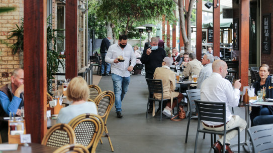 People eat lunch at Brisbane’s Breakfast Creek Hotel on Wednesday.