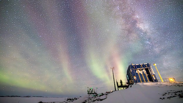 “A thin covering of cloud turned the ordinarily electric-green and red aurora into a spread of pastels above the Bureau of Meteorology building,” says photographer and Antarctic station carpenter Jared McGhie.