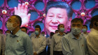 Visitors to the memorial built on the site of the first Communist Party congress in 1921, with Xi Jinping on a screen, June 2021.