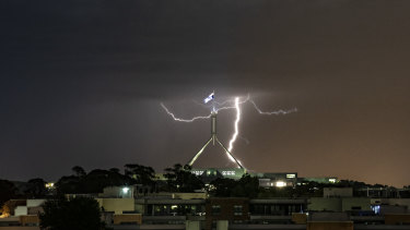 Lightning strikes over Canberra on Tuesday night as a storm front rolled through.