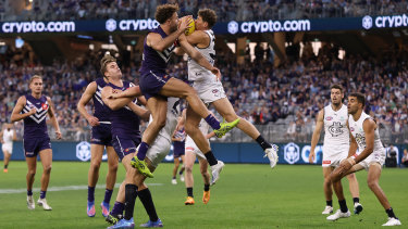 Charlie Curnow flies for a mark against Fremantle’s Griffin Logue in their Round 6 clash.