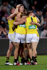 Richmond players celebrate their hard-fought win. 