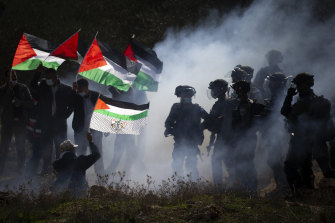 Israeli border police officers clash with Palestinians during a protest against the expansion of Israeli settlements near the West Bank town of Salfit in December. 
