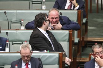 Barnaby Joyce chats to Nationals colleague George Christensen during question time earlier this year.