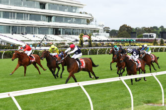 Johnny Get Angry wins the Victoria Derby in front of empty Flemington grandstands in 2020.