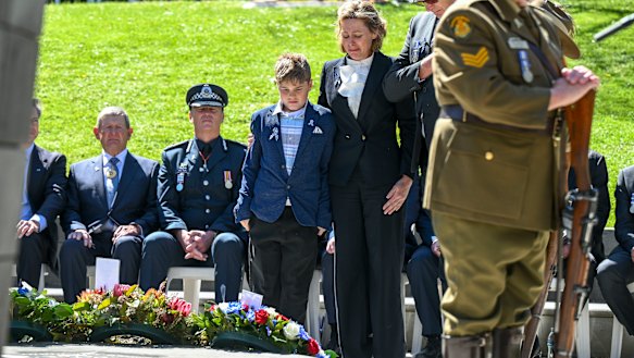 Slain Victoria Police officer Detective Leading Senior Constable Neal Thompson’s loved ones: His partner, Sergeant Lisa Thompson, and her young son, lay a wreath on the National Police Remembrance Day.