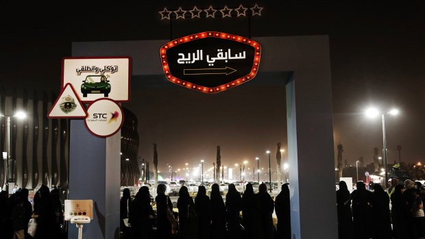 Women wait in line to ride go carts at a road safety event for female drivers launched at the Riyadh Park Mall. Saudi women have only been allowed to drive since last year.