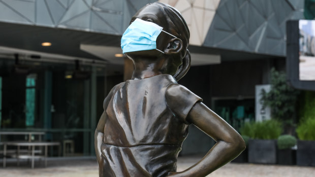The Fearless Girl Statue in Federation Square donned a face mask during Melbourne’s lockdown.