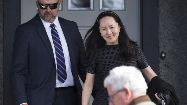Meng Wanzhou, back right, is out on bail and remains under partial house arrest in Canada.