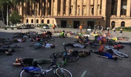 Fifty cyclists laid down in King George Square on Friday as part of a so-called "die-in", organised by Extinction Rebellion. 