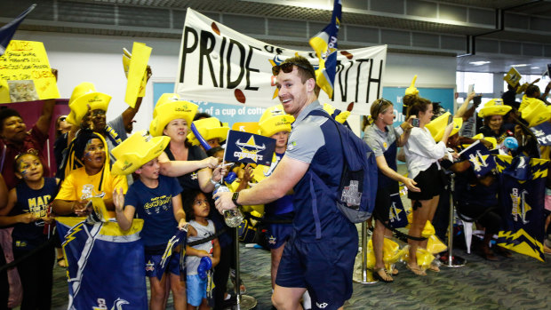 Cost of success: Fans farewell the Cowboys from Townsville Airport before the 2017 grand final.