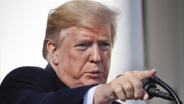 President Donald Trump points to a member of the media after declaring a national emergency in order to build a wall along the southern border.