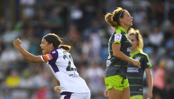Perth Glory superstar Sam Kerr celebrates as her shot is deflected in by Canberra United captain Rachel Corsie.