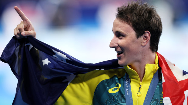 Cam McEvoy celebrates his gold medal.