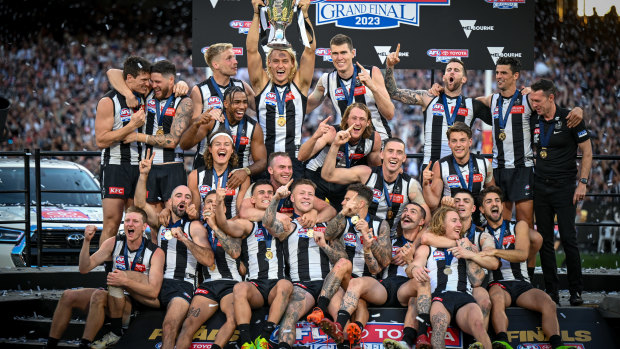 The Magpies celebrate after their 2023 premiership.