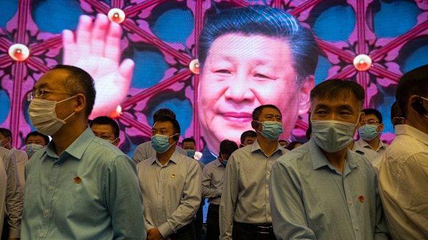 Visitors to the memorial built on the site of the first Communist Party congress in 1921, with Xi Jinping on a screen, June 2021.