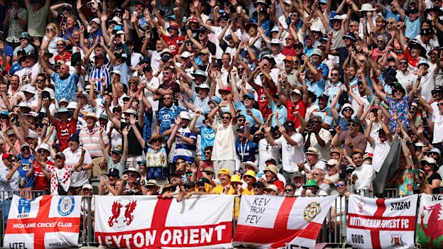 The Barmy Army’s singing and chanting traditions can be traced back to Britain’s most popular sport. Note the football jerseys and flags. 