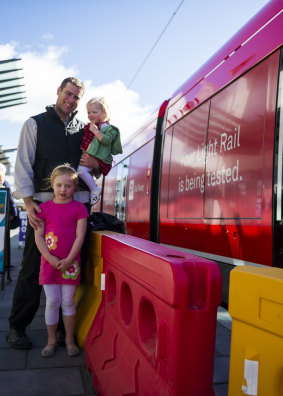 Steven Mirtschin with his daughters Amelia, 5, and Georgia, 1. Steven's business has  suffered because of light rail construction. 