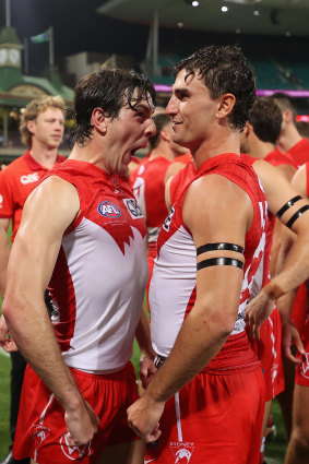 The Swans celebrate their round zero victory against Melbourne in front of a sellout crowd at the SCG.