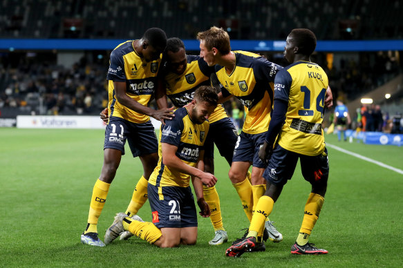 Michael Ruhs celebrates a goal set up by Garang Kuol (right).