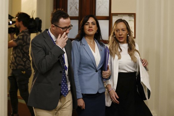 Victorian Liberal MP Moira Deeming (centre) enters the party room meeting today. 
