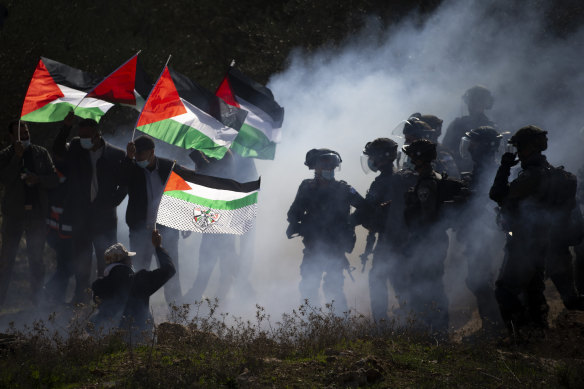 Israeli border police officers clash with Palestinians during a protest against the expansion of Israeli settlements near the West Bank town of Salfit in December. 