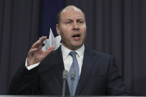 Former treasurer Josh Frydenberg unveiling the mid-year budget update in 2019, when the government committed $480 million to its business register reform.