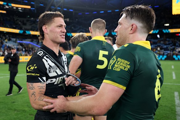 Ponga is seen speaking with Munster post-game in a sling.