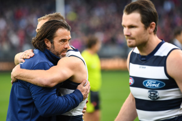 Chris Scott embraces Cats skipper Joel Selwood after the loss.