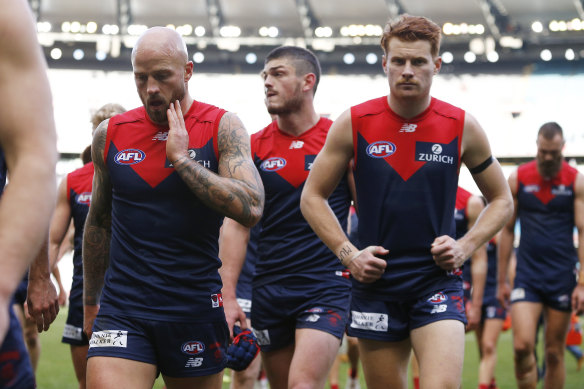 Dejected Demons head off the ground after a round 21 loss to Collingwood.