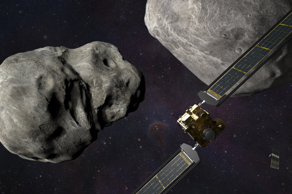 Artist’s rendering of NASA’s DART probe, foreground right, and Italian Space Agency’s LICIACube, bottom right, at the Didymos system before impact with the asteroid Dimorphos, left.