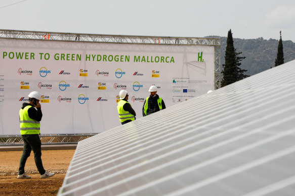 Solar panels stand in front of an old cement factory to produce green hydrogen in Mallorca. 