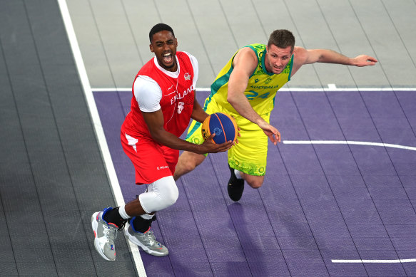 Australia’s Jesse Wagstaff and England’s Jamell Anderson do battle during the 3x3 basketball gold medal match.