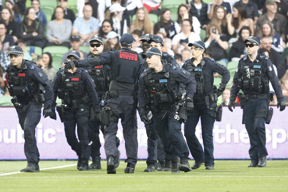 Victoria Police respond to unruly fans. 