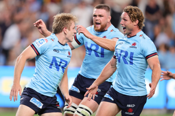 Max Jorgensen (left) celebrates with Waratahs teammates after scoring on debut against the Brumbies.