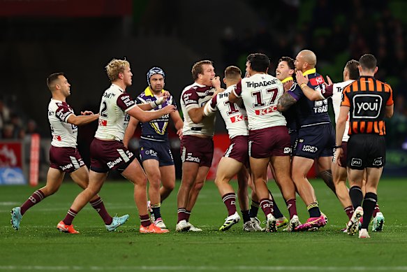 The players have a stoush during the match.