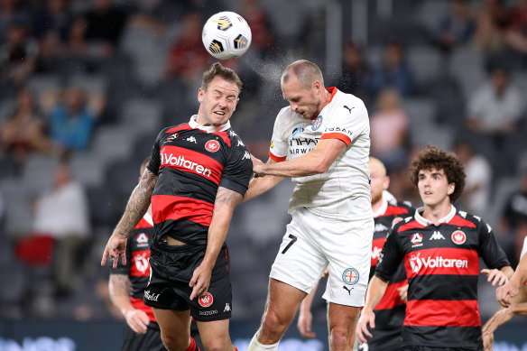 Simon Cox and Rostyn Griffiths battle for a high ball.