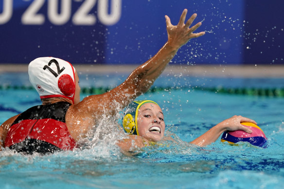 Australia’s Abby Andrews, right, is defended by Canada’s Shae la Roche.