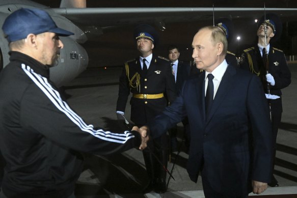 Russian President Vladimir Putin greets Vadim Krasikov upon arrival of freed Russian prisoners at Vnukovo government airport outside Moscow, Russia.