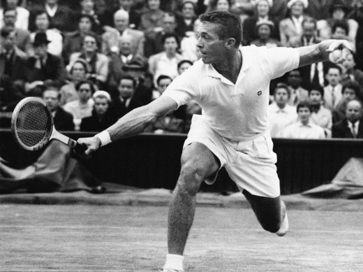 Tony Trabert makes a return to Kurt Nielson on centre court at Wimbledon, July 1, 1955. 