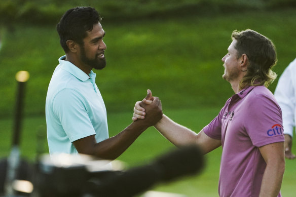 Cameron Smith (right) congratulates Tony Finau after the American’s drought-breaking win on the PGA Tour.
