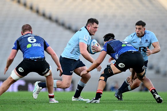 Angus Bell of the Waratahs charges forward