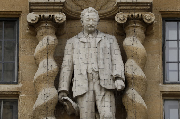 A statue of Cecil Rhodes, the controversial Victorian imperialist who supported apartheid-style measures in southern Africa stands mounted on the facade of Oriel College in Oxford, England. 