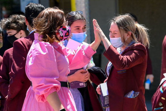 Year 12 students at Marymede Catholic College celebrate finish their English exam.